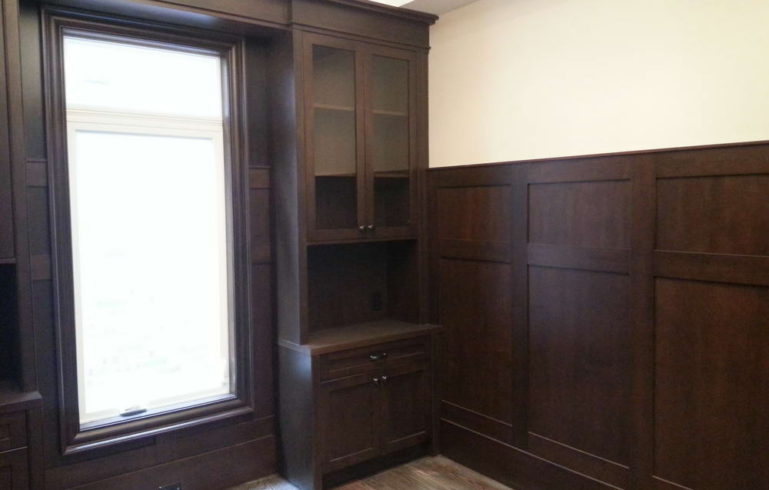 Room Addition in Custom Home Renovation with Trim and Shelving