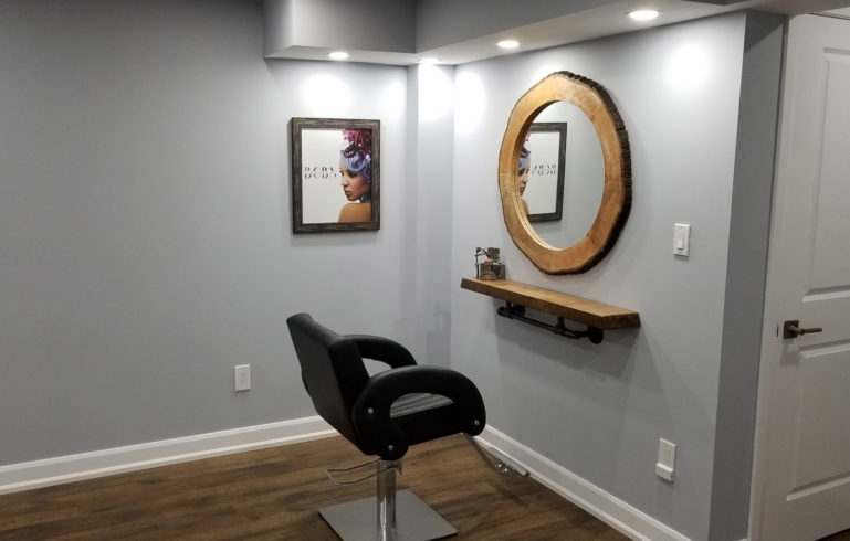 custom basement finishing with wall mirror